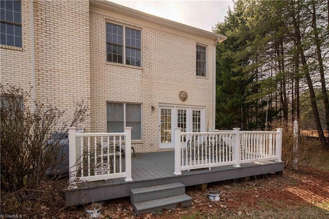 back of house with a wooden deck