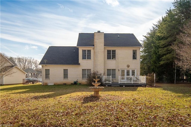 back of house with a wooden deck and a yard