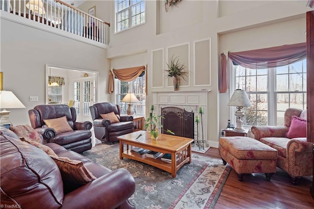 living room featuring plenty of natural light and hardwood / wood-style floors