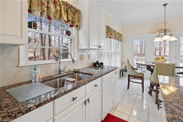 kitchen featuring white cabinetry, ornamental molding, dishwasher, and sink