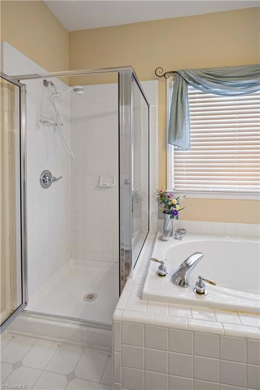 bathroom featuring plus walk in shower