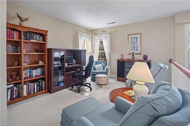 home office featuring light colored carpet