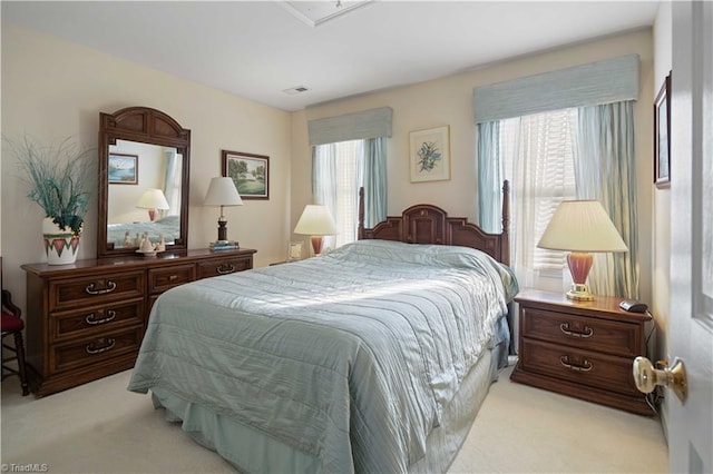 carpeted bedroom with multiple windows