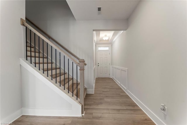 stairway featuring hardwood / wood-style floors