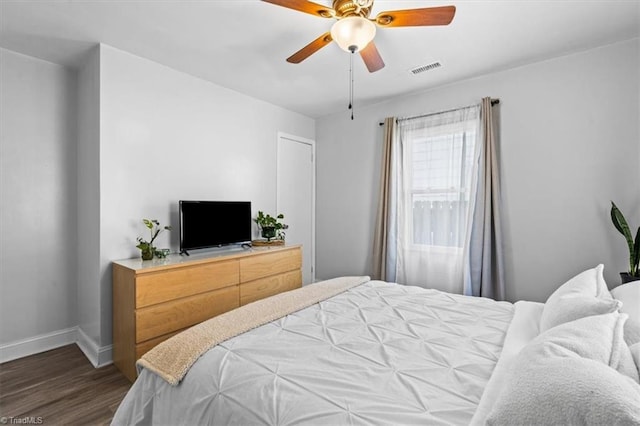 bedroom featuring ceiling fan and dark wood-type flooring