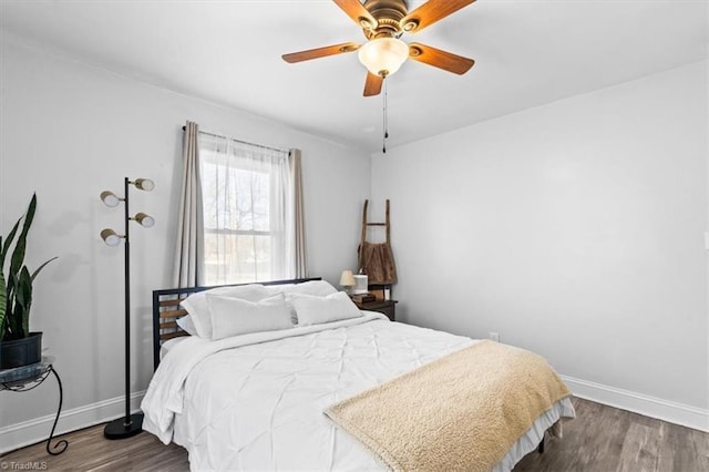 bedroom with hardwood / wood-style floors and ceiling fan