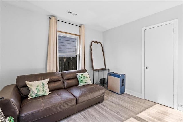 living room with light hardwood / wood-style floors