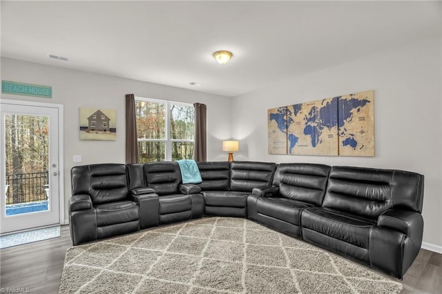 living room with visible vents and wood finished floors