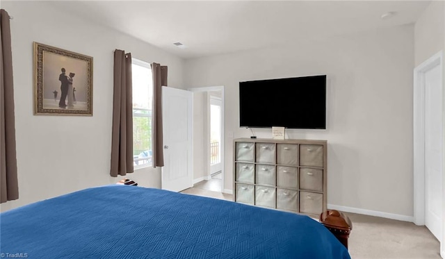 bedroom featuring carpet flooring, visible vents, and baseboards