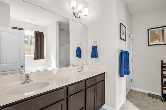 full bathroom with tile patterned flooring, a sink, baseboards, and double vanity