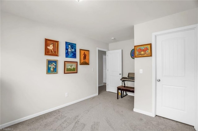 bedroom featuring carpet floors and baseboards