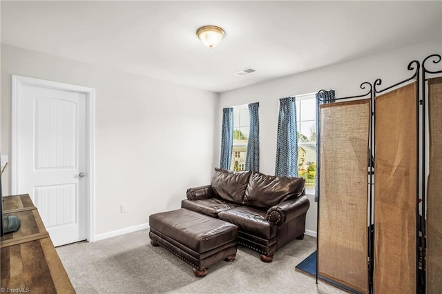 interior space with carpet floors, visible vents, and baseboards