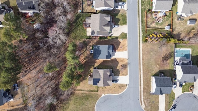 birds eye view of property with a residential view