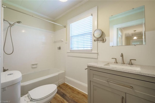 full bathroom with toilet, ornamental molding, wood finished floors, tub / shower combination, and vanity