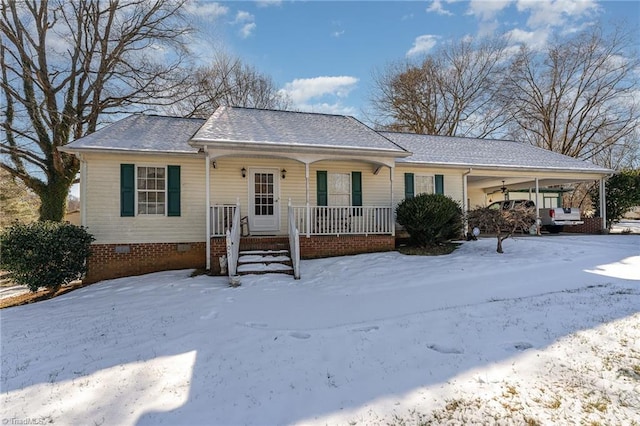 ranch-style house with covered porch and a carport