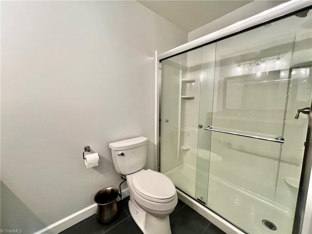 4003 Honey Locust Ct, Greensboro, NC 27410 - bathroom featuring a shower stall, tile patterned flooring, toilet, and baseboards