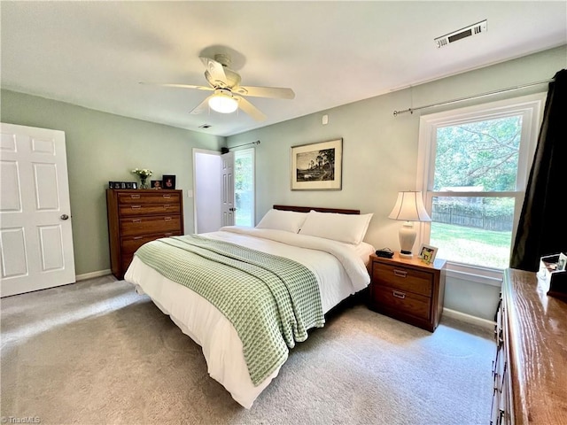 4003 Honey Locust Ct, Greensboro, NC 27410 - bedroom with light carpet, multiple windows, and baseboards