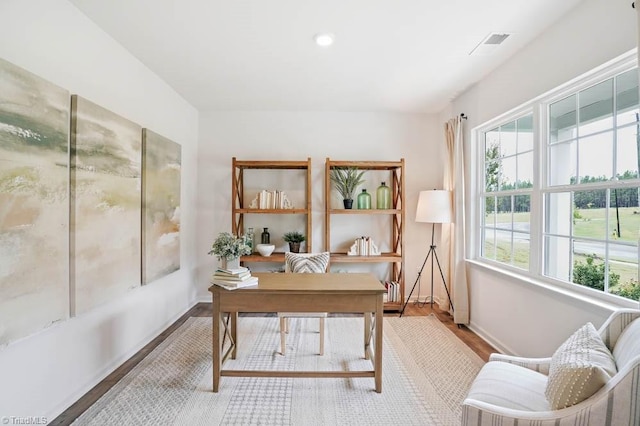 office with light hardwood / wood-style flooring