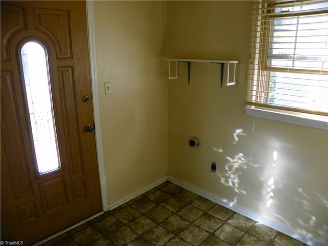 laundry area with electric dryer hookup and plenty of natural light