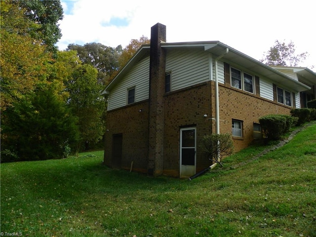 view of home's exterior featuring a lawn