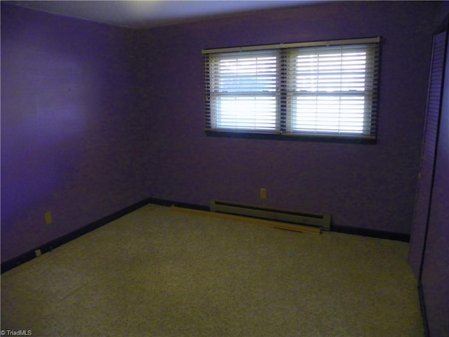 spare room featuring a baseboard radiator