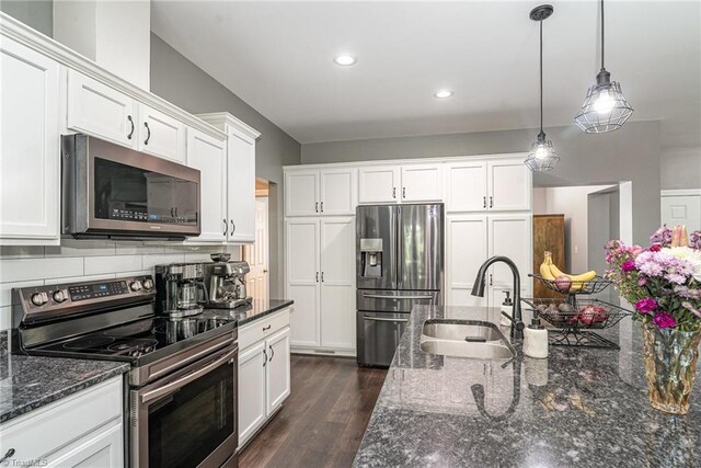 817 Jefferson Rd, Greensboro, NC 27410 - kitchen with appliances with stainless steel finishes, a sink, white cabinets, recessed lighting, and pendant lighting