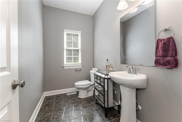 817 Jefferson Rd, Greensboro, NC 27410 - bathroom with toilet and baseboards