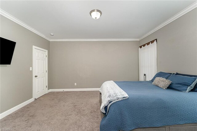 817 Jefferson Rd, Greensboro, NC 27410 - bedroom featuring crown molding, baseboards, and carpet
