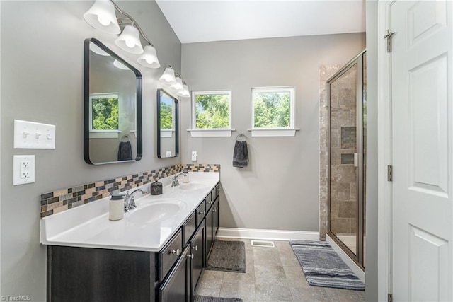 817 Jefferson Rd, Greensboro, NC 27410 - bathroom with baseboards, double vanity, and a stall shower