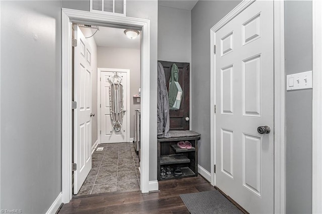 817 Jefferson Rd, Greensboro, NC 27410 - hall featuring dark wood finished floors and baseboards