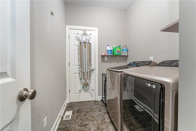 817 Jefferson Rd, Greensboro, NC 27410 - laundry area with washer and clothes dryer and baseboards