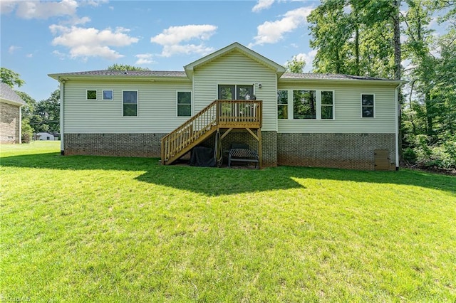 817 Jefferson Rd, Greensboro, NC 27410 - back of property featuring crawl space, a lawn, stairs, and a wooden deck