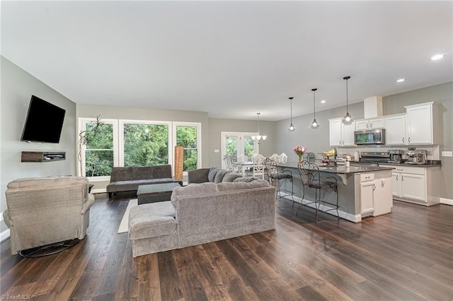 817 Jefferson Rd, Greensboro, NC 27410 - living area with dark wood-style flooring, recessed lighting, a chandelier, and baseboards