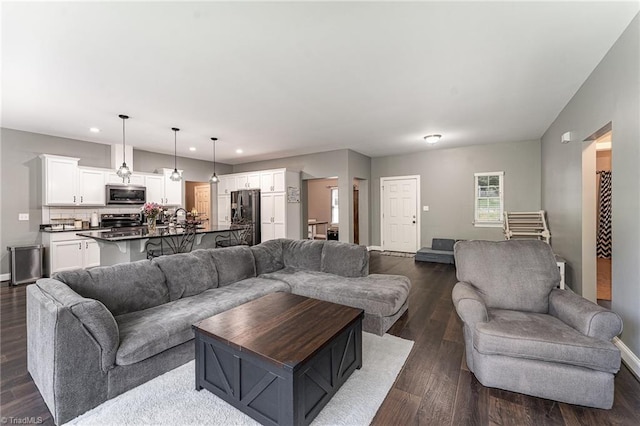 817 Jefferson Rd, Greensboro, NC 27410 - living area featuring baseboards, dark wood-style floors, and recessed lighting