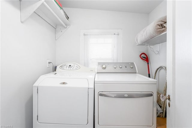 laundry area with laundry area and separate washer and dryer