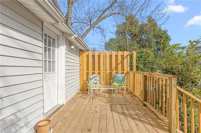 wooden terrace featuring outdoor dining space