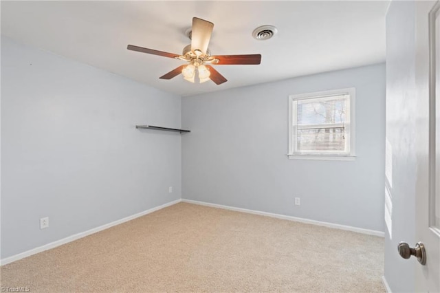 carpeted empty room with ceiling fan