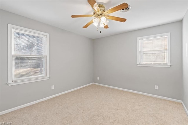 carpeted empty room with ceiling fan