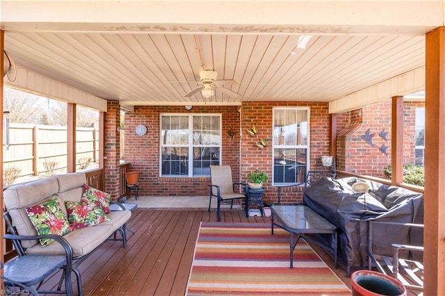 wooden deck featuring area for grilling, a ceiling fan, and fence