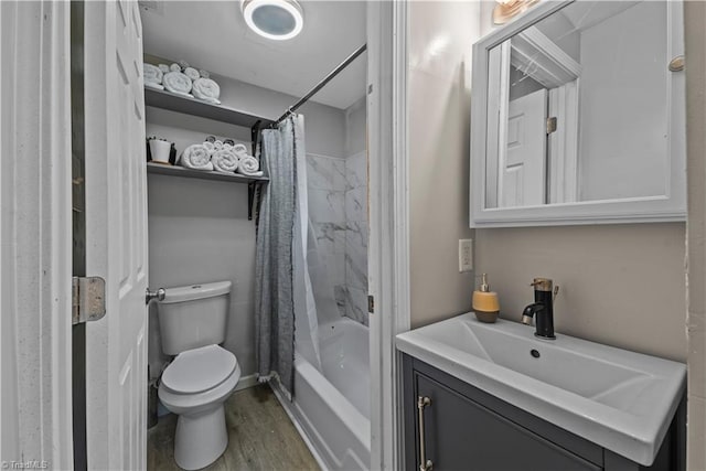 full bathroom featuring hardwood / wood-style flooring, vanity, shower / bath combination with curtain, and toilet