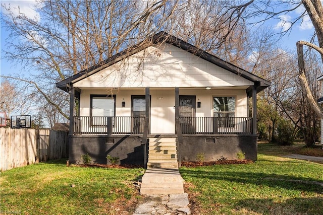 bungalow featuring a front yard and covered porch