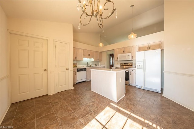 kitchen with decorative light fixtures, a center island, white appliances, and light brown cabinetry