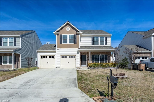 view of front of house featuring board and batten siding, a front yard, driveway, and a garage