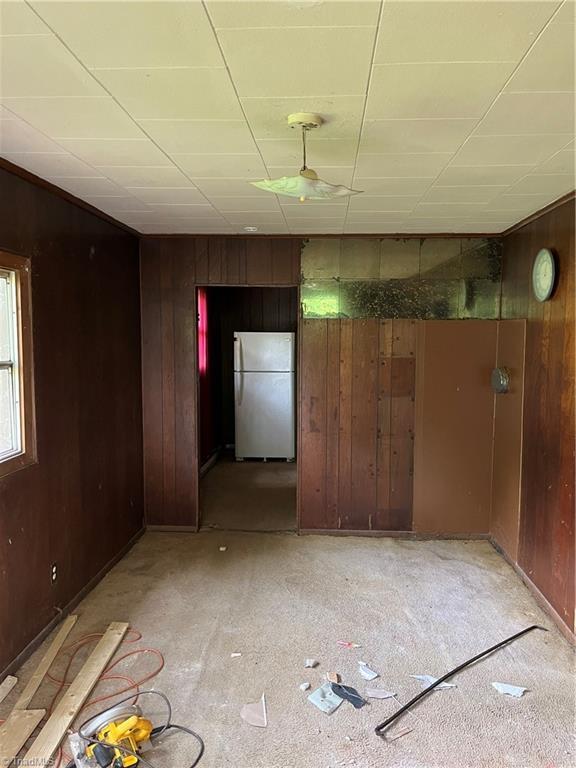 empty room with wooden walls