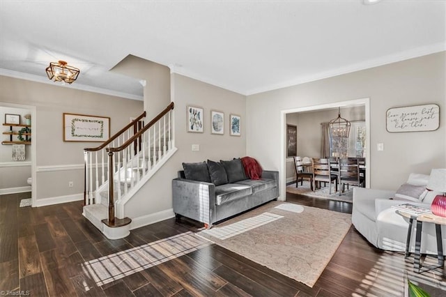 living room featuring dark wood-type flooring and ornamental molding