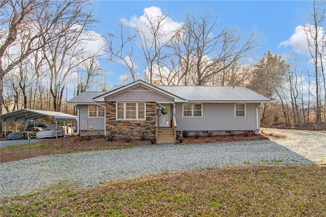 view of front of home with a front yard and a carport