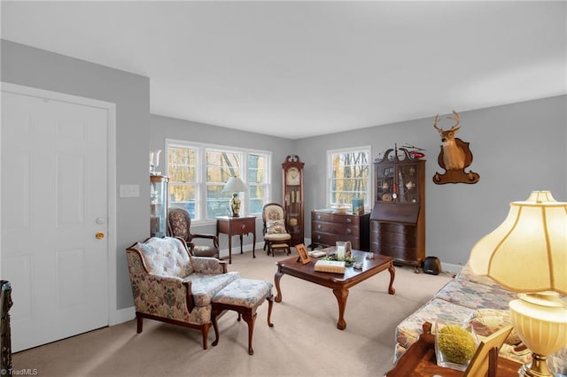 carpeted living room with a healthy amount of sunlight