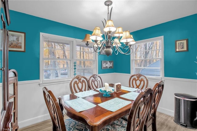 dining room featuring a chandelier and light hardwood / wood-style flooring