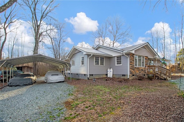 view of side of home with a carport