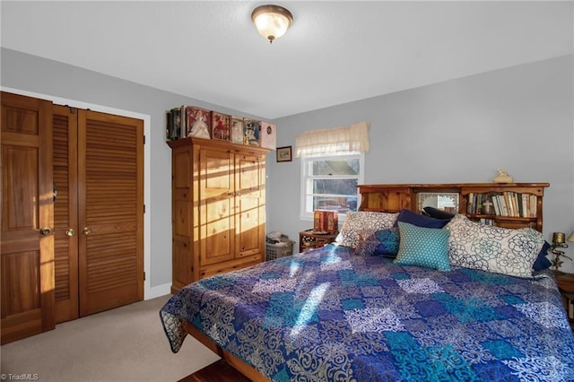 carpeted bedroom featuring a closet